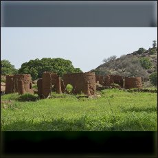 The remains of traditional houses after government bombardement of Rekha.