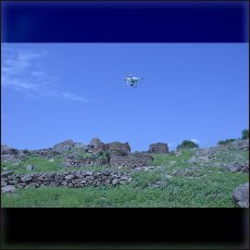 Our quadrocopter above the ruins of an burned village in Nuba Mountains.